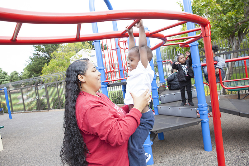 Mom with child on playground