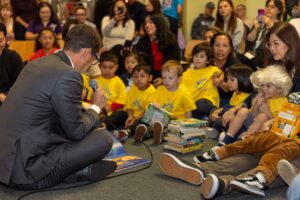 Mayor Daniel Lurie reads a children's book to a group of children